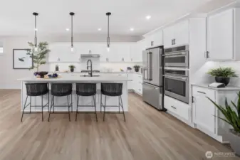 Large island for gatherings, baking or visiting while making a delish meal for your guests. All pictures are of model home.  Layout is the same, but materials and colors will vary.