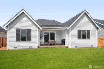 Spacious Rear yard w/ full fencing and a gate. Landscape not included, but available to purchase).  Full fencing is included.  All pictures are of model home.  Layout is the same, but materials and colors will vary.
