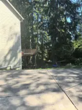 Outside area leading to unfinished daylight basement with separate entrance.