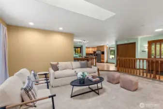 Open Concept Living room view into the kitchen and entry.