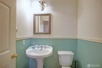 Cute guest bathroom is conveniently located in living area hallway!