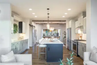 Stylish kitchen updated with custom cabinet paint, lighting, and tile backsplash.