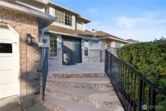 Steps to the entrance and brand new front doors.