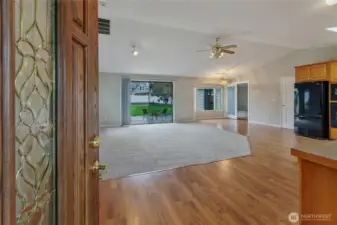 Experience the perfect harmony of indoor-outdoor living in this sun-drenched Great Room. Massive windows and a seamless transition to the professional hardscape patio "bring the outside in," creating an expansive environment for entertaining. Whether you're hosting a summer BBQ on the s patio or enjoying a quiet morning with morning sun filtered by the kitchen's garden window, this rambler perfectly blends modern interior comfort with its lush, nearly 1/3-acre surroundings.