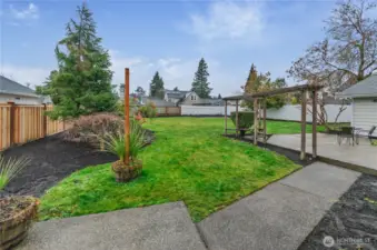 Professionally landscaped backyard has easy access from the Primary Bedroom, Great Room and Bonus Space.