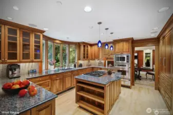 Gourmet Kitchen with Wood Paneled Sub-Zero, Dacor, Bosch appliances, by Canyon Creek cabinets. Enjoy Lake Views from the Copper Bow Beveled Windows.