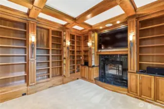 Family room also accomodates all your  books as your library as well. Cast Iron fireplace conveys turn of the century look by Vermont Casting/Majestic fireplaces. Flat screen tv stays.
