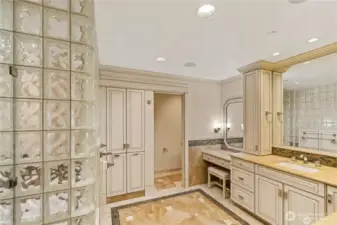 Beautiful Canyon Creek Cabinets, heated marble tile flooring with inlay boarders accented by Crown Molding.