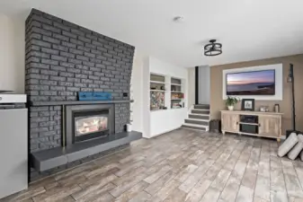 LOWER LEVEL FAMILY ROOM WITH ANOTHER FIREPLACE