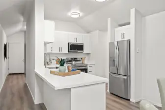 Updated kitchen with quartz counters and stainless appliances.