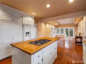 Just off of the kitchen is a large family room, which was an addition to the home. Vaulted ceilings, hardwood floors, French doors to the outdoor deck and mostly fenced side yard.