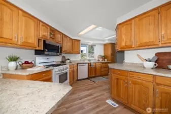 You'll love the size of this kitchen! SO much storage and space to host family dinners or bake with friends.