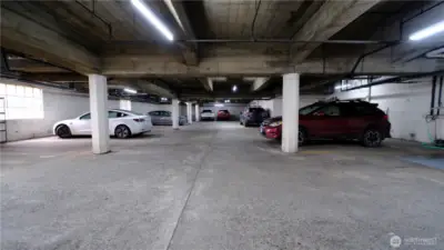 Parking garage with one spot with the condo.