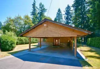 Covered carport welcomes you Home to the front door, great for those rainy days. Dead bolt for added security