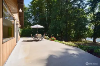 Patio great for get togethers or evenings enjoyed dappled through the mature trees that offer shade.