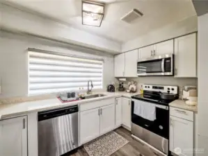 Open kitchen with access to living and dining areas