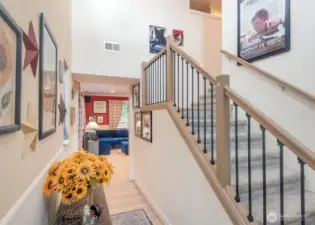 Vaulted ceilings greet you along with this gorgeous and reinforced bannister.