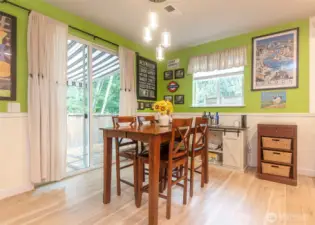 Dining space leading to perfectly appointed back yard.