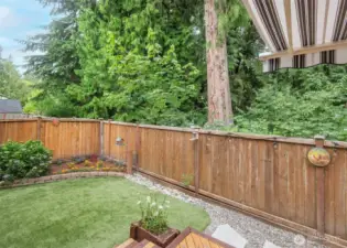 Private green belt behind home.