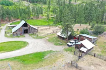 Aerial of outbuildings including barn, workshop, storage, and livestock shelters