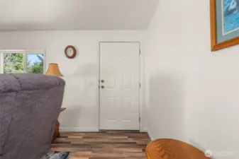 Enjoy the fresh look and feel of new flooring as you enter into the spacious, light-filled living area.