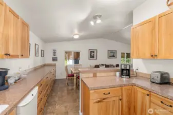 Warm, natural hickory cabinets add timeless beauty and charm to kitchen - the heart of the home.