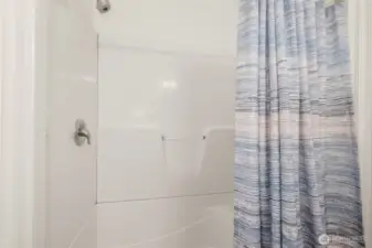 Enjoy the ease of a walk-in shower in the main bath—perfect for guests and daily use.