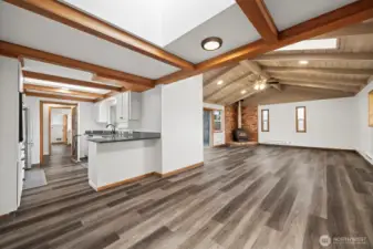 Large open family room with vaulted ceilings and sky lights