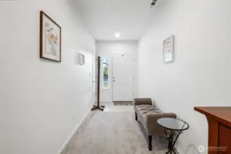 Looking back at the front door, you'll be glad you have a closet to put your coats and shoes in order to keep the carpet immaculate.