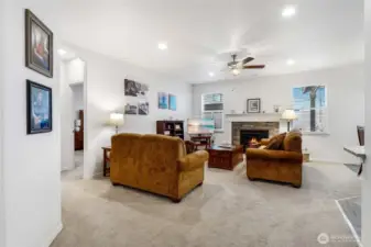 The living room has a great amount of space for everyone to gather, and the primary bedroom is off to the left of the sofa.