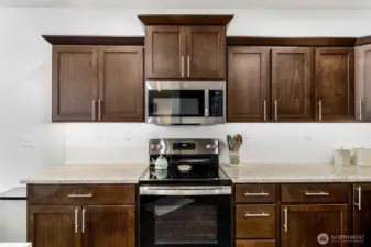 Do you bake or cook? This oven/stove setup with the microwave above will help you make your favorite dishes.