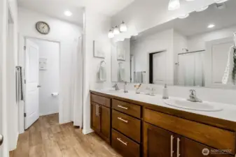 The primary bathroom has dual sinks, a large walk-in closet, and private commode room.