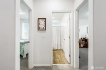 Back toward the front of the house we have the two other bedrooms, where the one on the left is used as a guest bedroom, and the one on the right, which is being used as a piano studio.