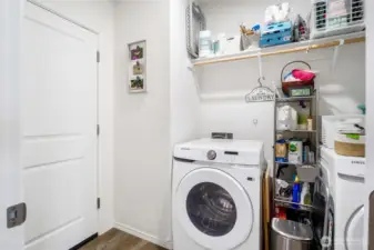 The laundry room is the perfect place to toss dirty clothes as you're heading into the garage to go to work!