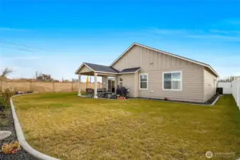 Another view of the backyard with vinyl fencing and also the block wall.  You'll never have to change anything on that block wall.  It's there to stay!