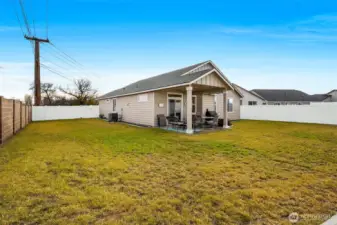The grass is greener...well, only on the golf course that this house sits down the road from, so if you're interested in mowing in the winter, this is the winter to do that!
