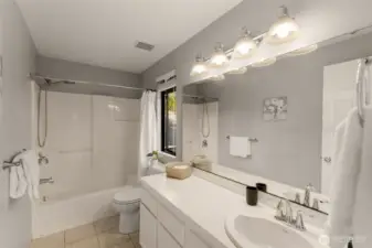 Upstairs hall bath is light and bright