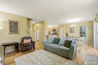 Open floor plan with living, dining, and kitchen areas.