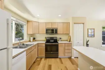 Kitchen with peninsula and stainless appliances.
