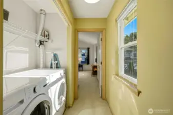 Upstairs laundry area with washer and dryer.