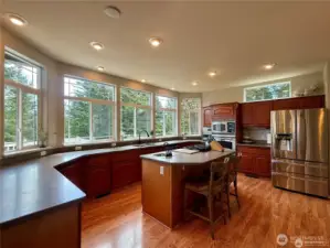 Enjoy the convenience of both a primary kitchen sink and a secondary sink on the kitchen island. The island also offers additional in-kitchen dining space at the counter.