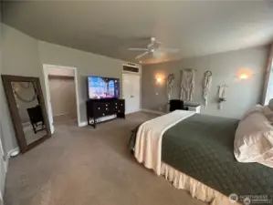 Large walk-in closet in primary bedroom.