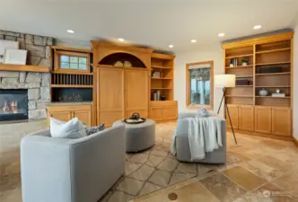 Family room with fireplace adjacent to the kitchen.