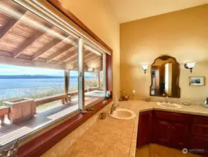 The primary ensuite even has an incredible view! The primary bathroom has a large walk-in closet and an amazing shower!