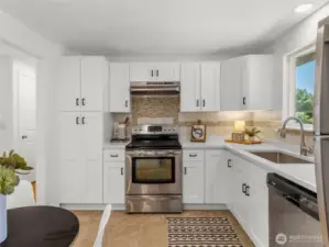All new cabinets, countertops, kitchen sink, and hood vent. All appliances stay!