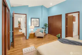 PRIMARY BEDROOM W/ LOTS OF CLOSET SPACE AND HIGH CEILINGS.