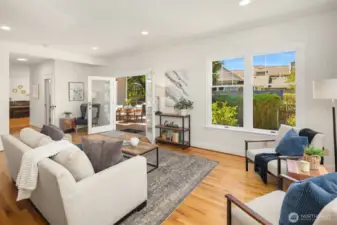 Warm and welcoming family room. Rich hardwood floors throughout much of main living area