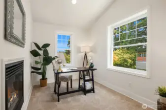 Private office attached to the primary bedroom with view through fireplace!