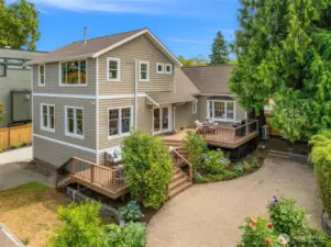 Large partially fenced yard with expansive outdoor living space
