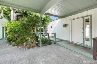 Covered entry. Deck wraps around to the back.